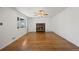 Bright living room with hardwood floors and a charming fireplace at 343 Melody Dr, Northglenn, CO 80260