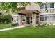 A well-kept condominium building featuring an inviting entrance with lush landscaping at 650 S Alton Way # 10A, Denver, CO 80247