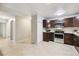 Updated kitchen features wood cabinets, stainless appliances, tile backsplash, and granite counters at 650 S Alton Way # 10A, Denver, CO 80247