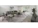 Bright living room features a sliding glass door leading to the outside at 650 S Alton Way # 10A, Denver, CO 80247