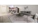 Bright open-plan living room with modern furnishings and adjacent dining area and kitchen at 650 S Alton Way # 10A, Denver, CO 80247
