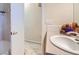 Functional bathroom with a shower over tub, and a white porcelain sink at 10165 W Iowa Ave, Lakewood, CO 80232