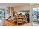 Cozy breakfast nook adjacent to the kitchen, with hardwood floors, and natural light at 10165 W Iowa Ave, Lakewood, CO 80232