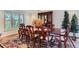 Formal dining room boasting a wooden table, elegant chairs, and a decorative china cabinet at 10165 W Iowa Ave, Lakewood, CO 80232