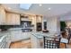 Bright kitchen with granite counters, stainless steel appliances, central island, and a double oven at 10165 W Iowa Ave, Lakewood, CO 80232