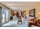 Cozy living room with access to the outdoor area, featuring plush seating and neutral décor at 10165 W Iowa Ave, Lakewood, CO 80232