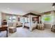 Spacious main bedroom suite featuring a large canopy bed and ample natural light at 10165 W Iowa Ave, Lakewood, CO 80232