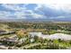 Community overview with lake, pool, and mountains at 3587 Vestal Loop, Broomfield, CO 80023