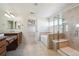 Bathroom with double sinks, soaking tub and walk-in shower at 3587 Vestal Loop, Broomfield, CO 80023