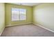 Simple carpeted bedroom with a window and neutral walls at 3587 Vestal Loop, Broomfield, CO 80023