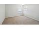 Simple bedroom with carpet flooring and two windows at 3587 Vestal Loop, Broomfield, CO 80023