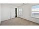 Bedroom with closet and two windows with blinds at 3587 Vestal Loop, Broomfield, CO 80023