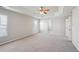 Bright bedroom with ensuite bathroom access and ceiling fan at 3587 Vestal Loop, Broomfield, CO 80023