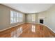 Living room with hardwood floors, fireplace, and large windows at 3587 Vestal Loop, Broomfield, CO 80023