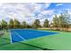 Community tennis court with blue surface at 3587 Vestal Loop, Broomfield, CO 80023