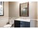 Stylish powder room with modern fixtures, wainscoting, and ample counter space at 1275 Washington Ave, Golden, CO 80401