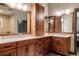 Elegant bathroom with double sinks, wooden cabinets, and ample counter space at 1275 Washington Ave, Golden, CO 80401