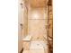 Tiled shower with built-in seating and glass door features attractive neutral colors and modern fixtures at 1275 Washington Ave, Golden, CO 80401