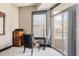 Cozy bedroom features a comfortable chair, a desk, and natural light at 1275 Washington Ave, Golden, CO 80401
