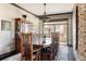 Formal dining room features a large wood table set with chairs, hardwood floors, and cabinet at 1275 Washington Ave, Golden, CO 80401