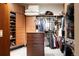 Spacious walk-in closet featuring custom shelving and wooden drawers, with ample storage for clothing and accessories at 1275 Washington Ave, Golden, CO 80401