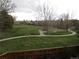 Large grassy area with a playground and trees creating a picturesque setting at 10522 Stoneflower Dr, Parker, CO 80134