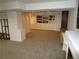 Finished basement boasts neutral carpet, a staircase, and a white bookcase with cabinet space at 10522 Stoneflower Dr, Parker, CO 80134