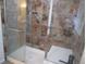 Tiled walk-in shower with glass door, providing a luxurious and modern feel at 10522 Stoneflower Dr, Parker, CO 80134