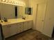 Bright bathroom with a double sink vanity, ample counter space, and updated fixtures provides comfort at 10522 Stoneflower Dr, Parker, CO 80134