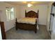 Cozy bedroom featuring a classic wooden bed frame and a ceiling fan for added comfort at 10522 Stoneflower Dr, Parker, CO 80134