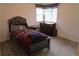 Comfortable bedroom with neutral walls, a bed, and window providing natural light for a cozy atmosphere at 10522 Stoneflower Dr, Parker, CO 80134