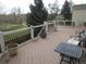 Relaxing deck area with outdoor seating and views of the lush green surroundings at 10522 Stoneflower Dr, Parker, CO 80134