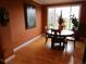 Dining room with hardwood floors and a round table set with chairs at 10522 Stoneflower Dr, Parker, CO 80134