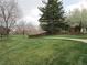 Expansive green space showcasing well-maintained lawns, mature trees, and a walking path at 10522 Stoneflower Dr, Parker, CO 80134
