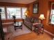 Cozy living room featuring hardwood floors, plush sofa, and bright natural light at 10522 Stoneflower Dr, Parker, CO 80134