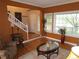 Inviting living room features hardwood floors, large windows, and a grand staircase entrance at 10522 Stoneflower Dr, Parker, CO 80134