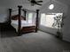 Spacious main bedroom features a canopy bed, large windows, and high ceilings for a relaxing retreat at 10522 Stoneflower Dr, Parker, CO 80134