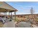 Relax on the covered patio or near the water feature in this scenic backyard at 13475 Spruce St, Thornton, CO 80602