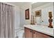 Classic half bathroom with white countertop, framed art, framed mirror and white shower at 13475 Spruce St, Thornton, CO 80602