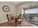 Cozy dining area features hardwood floors and access to outdoor patio at 13475 Spruce St, Thornton, CO 80602