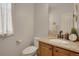 Charming half bathroom features granite countertop and decorative wall accents at 13475 Spruce St, Thornton, CO 80602