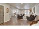 Finished basement living area with hardwood floors, gray couches, and an entertainment center at 13475 Spruce St, Thornton, CO 80602