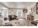 Finished basement living room with hardwood floors, sectional sofa and a TV at 13475 Spruce St, Thornton, CO 80602