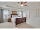 Spacious main bedroom features a tray ceiling, large windows, and ensuite bathroom at 13475 Spruce St, Thornton, CO 80602