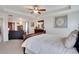 Spacious main bedroom with tray ceiling and sitting area; great natural light at 13475 Spruce St, Thornton, CO 80602