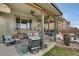 Enjoy the covered patio with a comfortable seating area, perfect for entertaining at 13475 Spruce St, Thornton, CO 80602