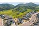 Aerial view of homes nestled against the backdrop of the Rocky Mountains at 5446 Mesa Top Dr, Monument, CO 80132