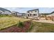 Beautiful backyard featuring native landscaping, outdoor patio, and mountain views at 5446 Mesa Top Dr, Monument, CO 80132