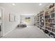 Finished basement features built-in bookshelves, natural light, and comfortable seating perfect for a library or playroom at 5446 Mesa Top Dr, Monument, CO 80132