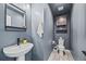 Elegant powder room with modern fixtures, stylish vanity, and sleek lighting at 5446 Mesa Top Dr, Monument, CO 80132